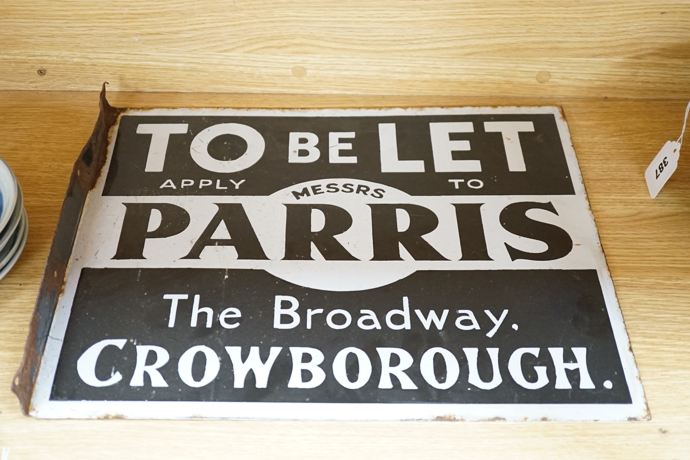 Two early 20th century 'Parris' and 'Innes', Crowborough, enamelled estate agent signs, 46cm wide. Condition - enamelling fair, edges mis-shapen